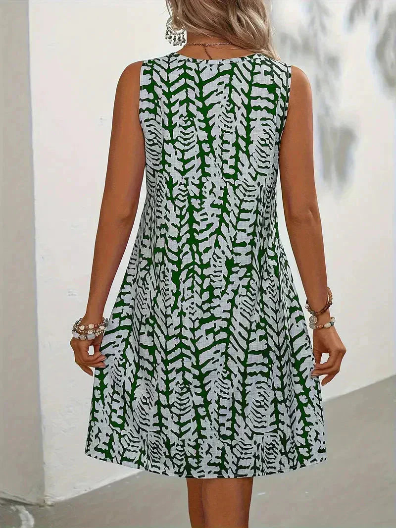 Yselda Robe Mini Femme – Robe d'Été Sans Manches avec Imprimé Élégant et Tissu Léger Respirant