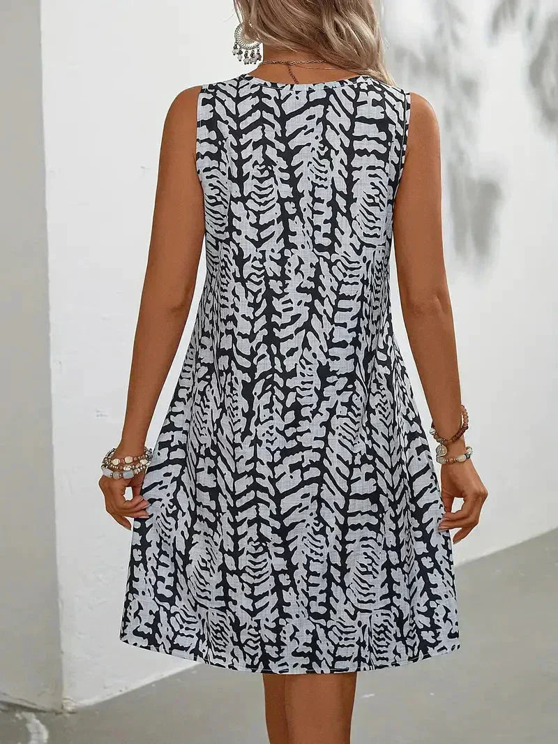 Yselda Robe Mini Femme – Robe d'Été Sans Manches avec Imprimé Élégant et Tissu Léger Respirant